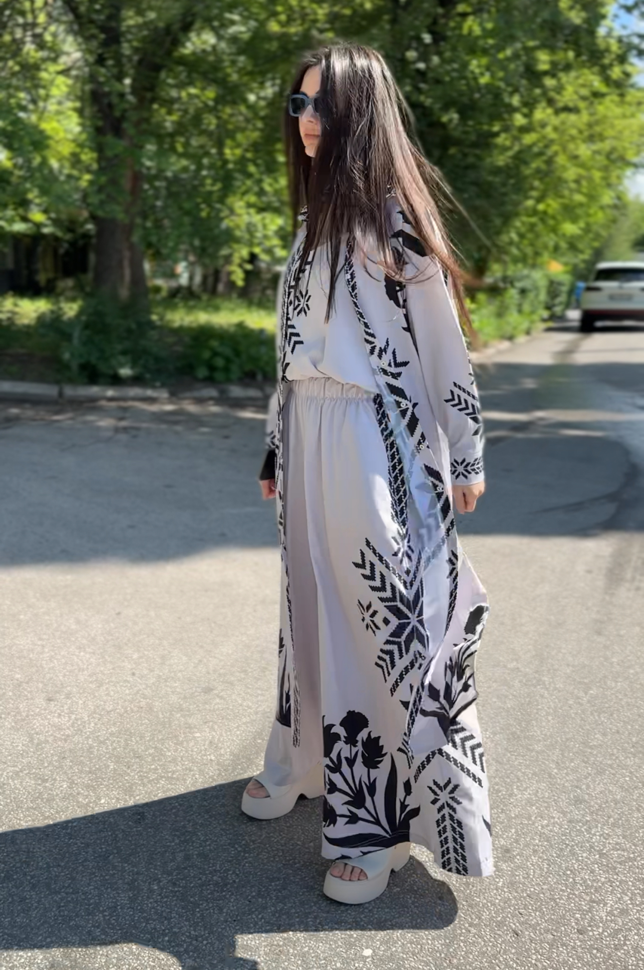 Elegant women’s suit, beige with national print